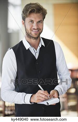 Waiter taking order in a restaurant View Large Photo Image Stock Image - Waiter taking order in a restaurant. Fotosearch