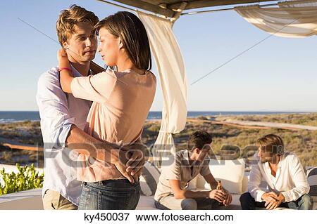Couple dancing in a party View Large Photo Image Stock Photo - Couple dancing in a party. Fotosearch