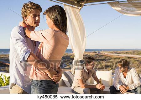 Couple dancing in a party View Large Photo Image Stock Photography - Couple dancing in a party. Fotosearch