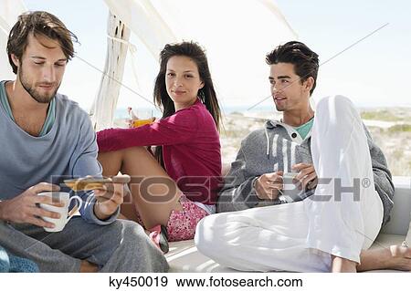 Friends having coffee View Large Photo Image Stock Photo - Friends having coffee. Fotosearch