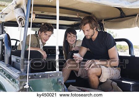 Three friends in SUV View Large Photo Image Stock Image - Three friends in SUV. Fotosearch