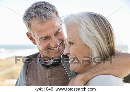 Close-up of a couple on the beach View Large Photo Image Stock Photograph - Close-up of a couple on the beach. Fotosearch