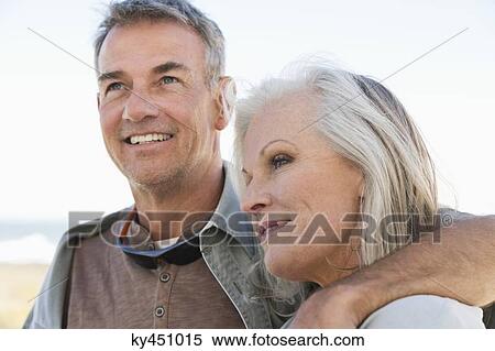 Stock Photography - Close-up of a couple on the beach. Fotosearch