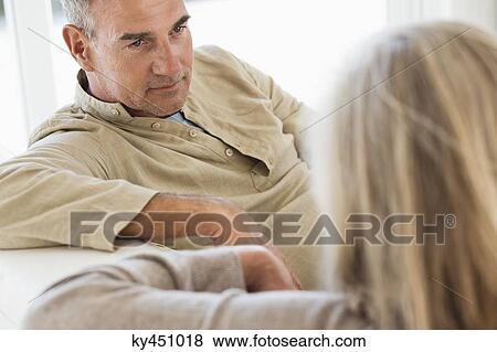 Close-up of a senior couple sitting on a couch View Large Photo Image Stock Photo - Close-up of a senior couple sitting on a couch. Fotosearch