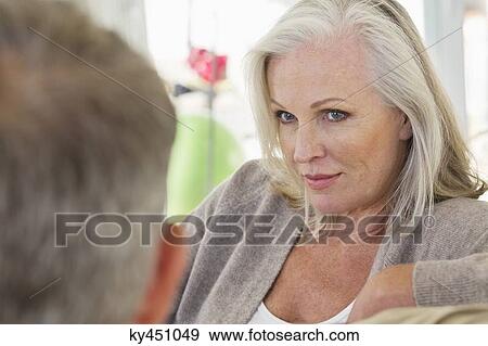 Close-up of a senior woman looking at her husband View Large Photo Image Stock Photo - Close-up of a senior woman looking at her husband. Fotosearch