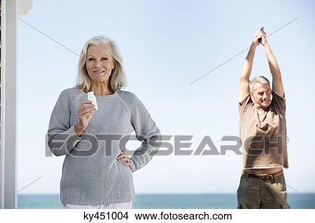 Couple enjoying on the beach View Large Photo Image Picture - Couple enjoying on the beach. Fotosearch