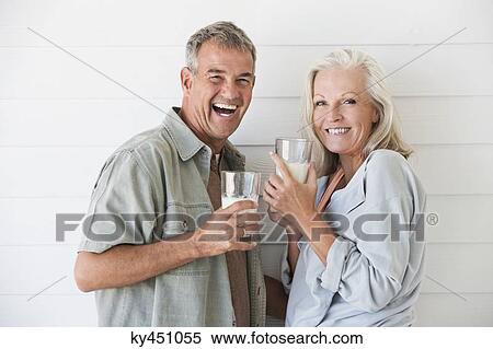 Portrait of a couple enjoying drink View Large Photo Image Stock Photography - Portrait of a couple enjoying drink. Fotosearch