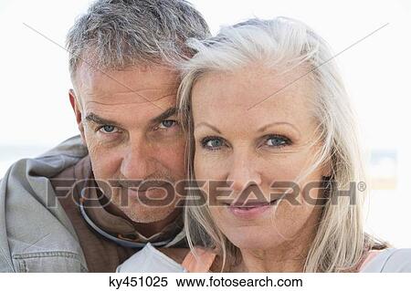 Portrait of a couple smiling on the beach View Large Photo Image Stock Photography - Portrait of a couple smiling on the beach. Fotosearch