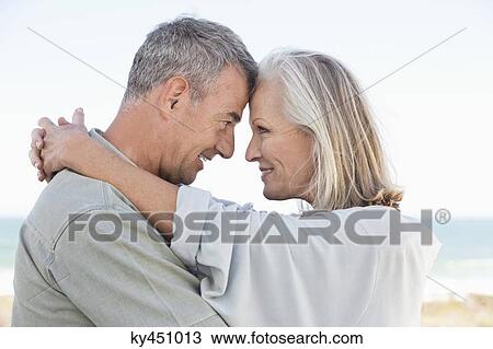 Romantic couple enjoying on the beach View Large Photo Image Stock Image - Romantic couple enjoying on the beach. Fotosearch