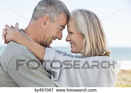 Stock Photo - Romantic couple enjoying on the beach. Fotosearch