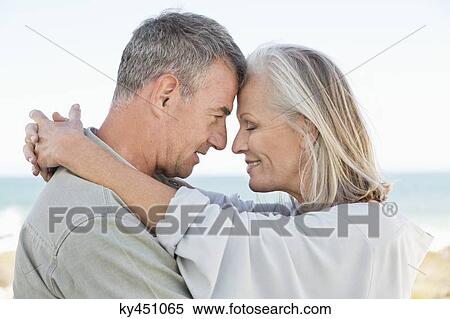 Stock Photography - Romantic couple enjoying on the beach. Fotosearch