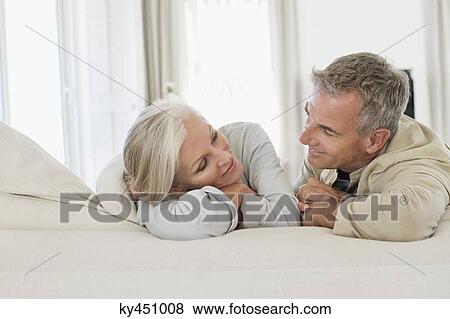 Senior couple resting on the bed View Large Photo Image Stock Photo - Senior couple resting on the bed. Fotosearch