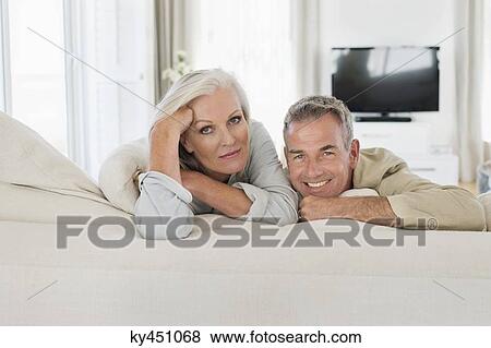 Senior couple resting on the bed View Large Photo Image Stock Photo - Senior couple resting on the bed. Fotosearch