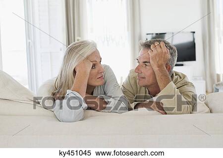 Stock Photography - Senior couple resting on the bed. Fotosearch