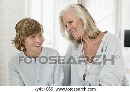 Stock Photograph - Woman and her grandson smiling. Fotosearch
