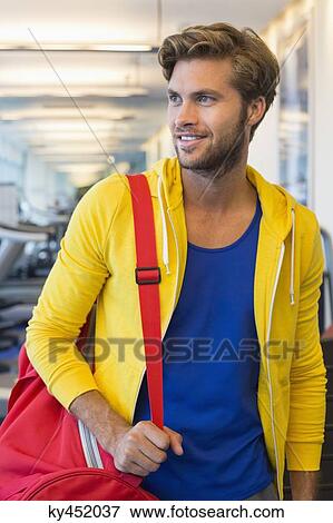 Man carrying a bag View Large Photo Image Stock Photo - Man carrying a bag. Fotosearch