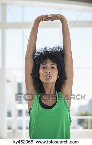Stock Photography - Woman stretching out her arms. Fotosearch