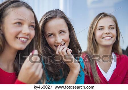 Close-up of three girls eating grapes View Large Photo Image Stock Photo - Close-up of three girls eating grapes. Fotosearch
