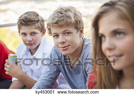 Stock Image - Friends smiling together. Fotosearch