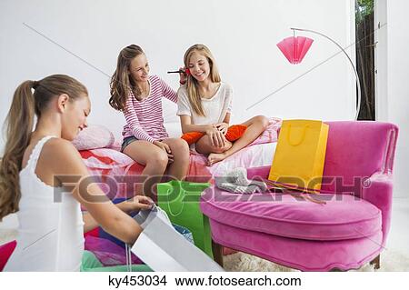 Girls enjoying good time at a slumber party View Large Photo Image Picture - Girls enjoying good time at a slumber party. Fotosearch