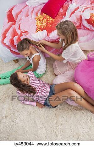 Girls enjoying good time at a slumber party View Large Photo Image Picture - Girls enjoying good time at a slumber party. Fotosearch