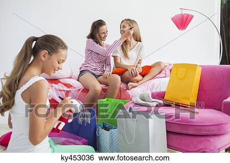 Girls enjoying good time at a slumber party View Large Photo Image Stock Photograph - Girls enjoying good time at a slumber party. Fotosearch