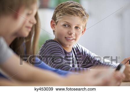 Stock Photo - Students in a classroom. Fotosearch