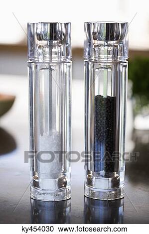 Salt shaker and pepper shaker at a kitchen counter View Large Photo Image Stock Image - Salt shaker and pepper shaker at a kitchen counter. Fotosearch