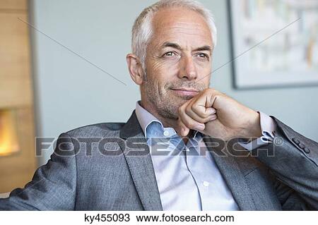 Close-up of a businessman thinking View Large Photo Image Stock Image - Close-up of a businessman thinking. Fotosearch