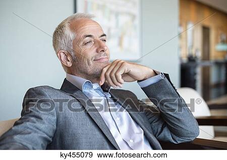 Close-up of a businessman thinking View Large Photo Image Stock Photo - Close-up of a businessman thinking. Fotosearch