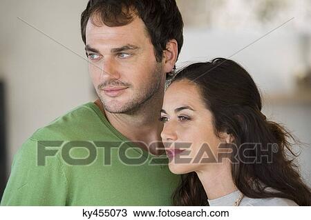 Stock Image - Close-up of a couple smiling. Fotosearch