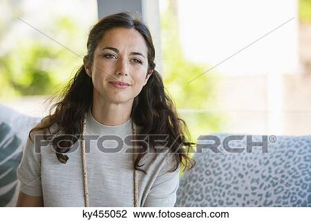Close-up of a woman smiling View Large Photo Image Stock Image - Close-up of a woman smiling. Fotosearch