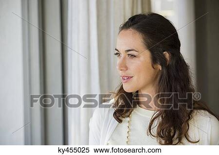 Stock Photography - Close-up of a woman smiling. Fotosearch