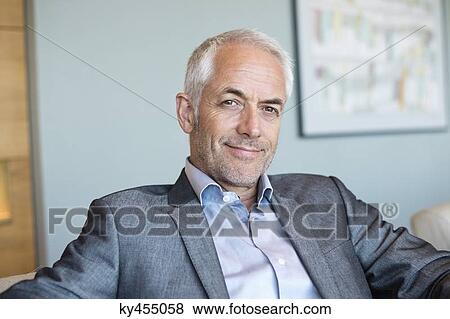 Portrait of a businessman smiling View Large Photo Image Stock Photo - Portrait of a businessman smiling. Fotosearch