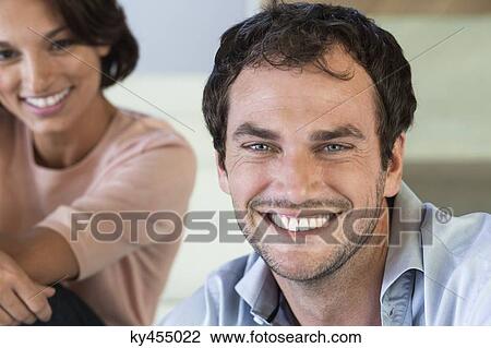 Portrait of a couple smiling View Large Photo Image Stock Image - Portrait of a couple smiling. Fotosearch
