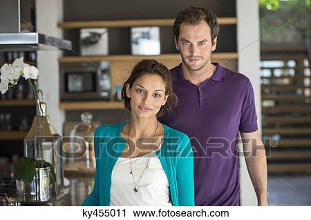Portrait of a couple standing together View Large Photo Image Stock Image - Portrait of a couple standing together. Fotosearch