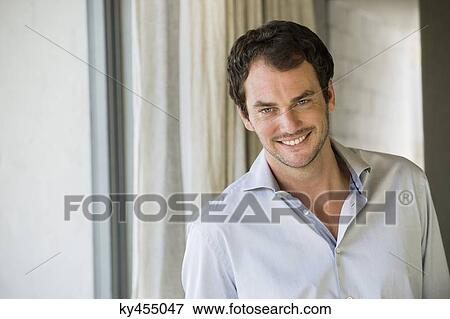 Stock Photo - Portrait of a man smiling. Fotosearch