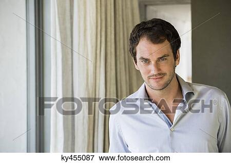 Stock Photo - Portrait of a man smiling. Fotosearch