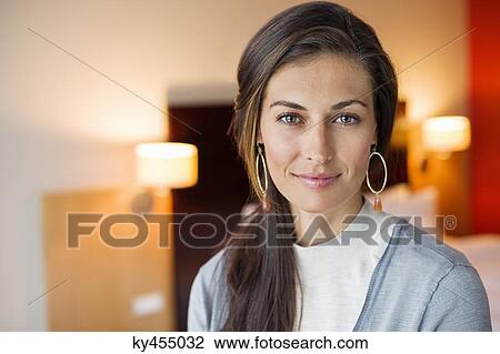 Portrait of a woman in a hotel room View Large Photo Image Stock Image - Portrait of a woman in a hotel room. Fotosearch