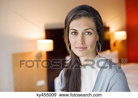 Portrait of a woman in a hotel room View Large Photo Image Stock Photo - Portrait of a woman in a hotel room. Fotosearch