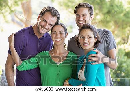 Stock Image - Portrait of four friends smiling. Fotosearch