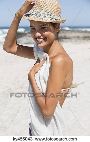 Beautiful woman posing on the beach View Large Photo Image Stock Image - Beautiful woman posing on the beach. Fotosearch