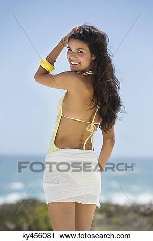 Beautiful woman posing on the beach View Large Photo Image Stock Image - Beautiful woman posing on the beach. Fotosearch