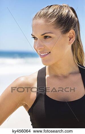 Close-up of a woman smiling View Large Photo Image Picture - Close-up of a woman smiling. Fotosearch