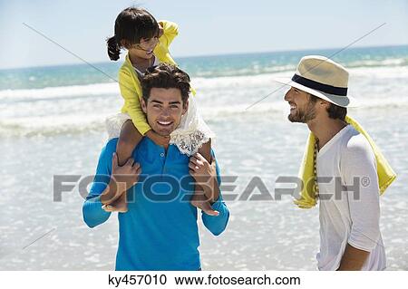 Family enjoying vacations on the beach View Large Photo Image Stock Image - Family enjoying vacations on the beach. Fotosearch