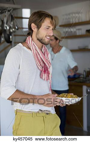 Man carrying a plate of food View Large Photo Image Stock Photography - Man carrying a plate of food. Fotosearch