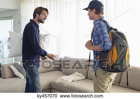 Man offering seat to his friend View Large Photo Image Stock Image - Man offering seat to his friend. Fotosearch