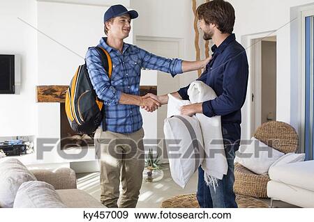 Man shaking hands with his friend View Large Photo Image Stock Photo - Man shaking hands with his friend. Fotosearch