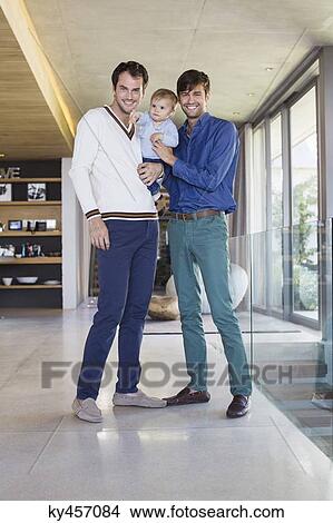 Parents smiling with their son at home View Large Photo Image Picture - Parents smiling with their son at home. Fotosearch