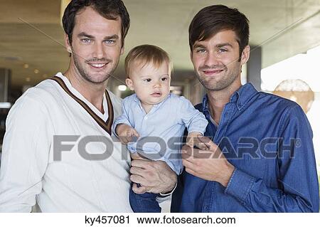 Parents smiling with their son at home View Large Photo Image Stock Image - Parents smiling with their son at home. Fotosearch